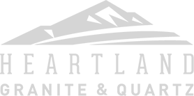 The logo for heartland granite and quartz shows a mountain and a river.