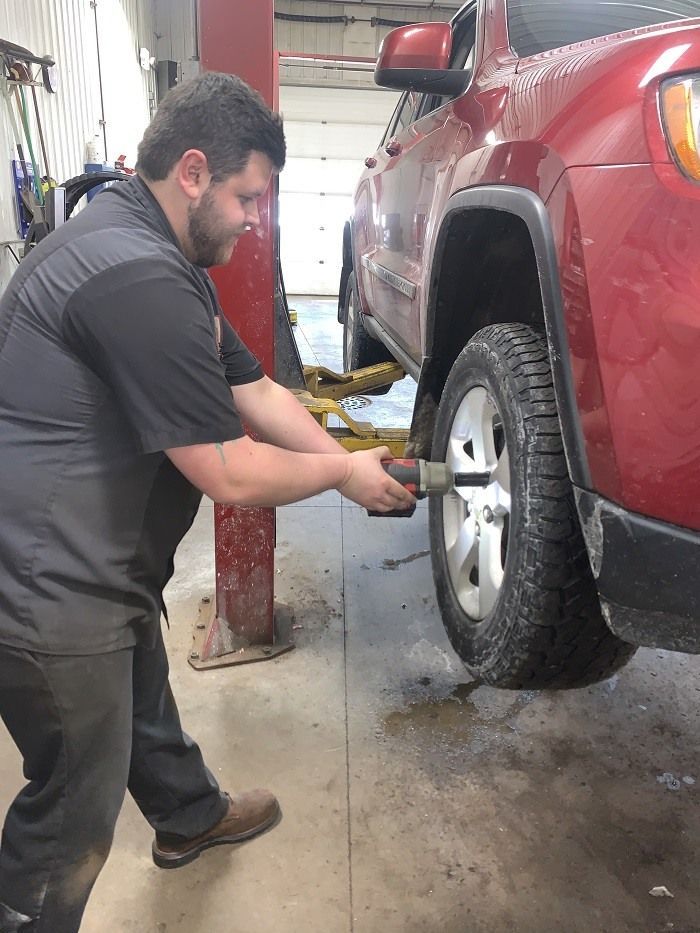 Our Mechanic Replace Tire - Cordell's Automotive Service & Tire