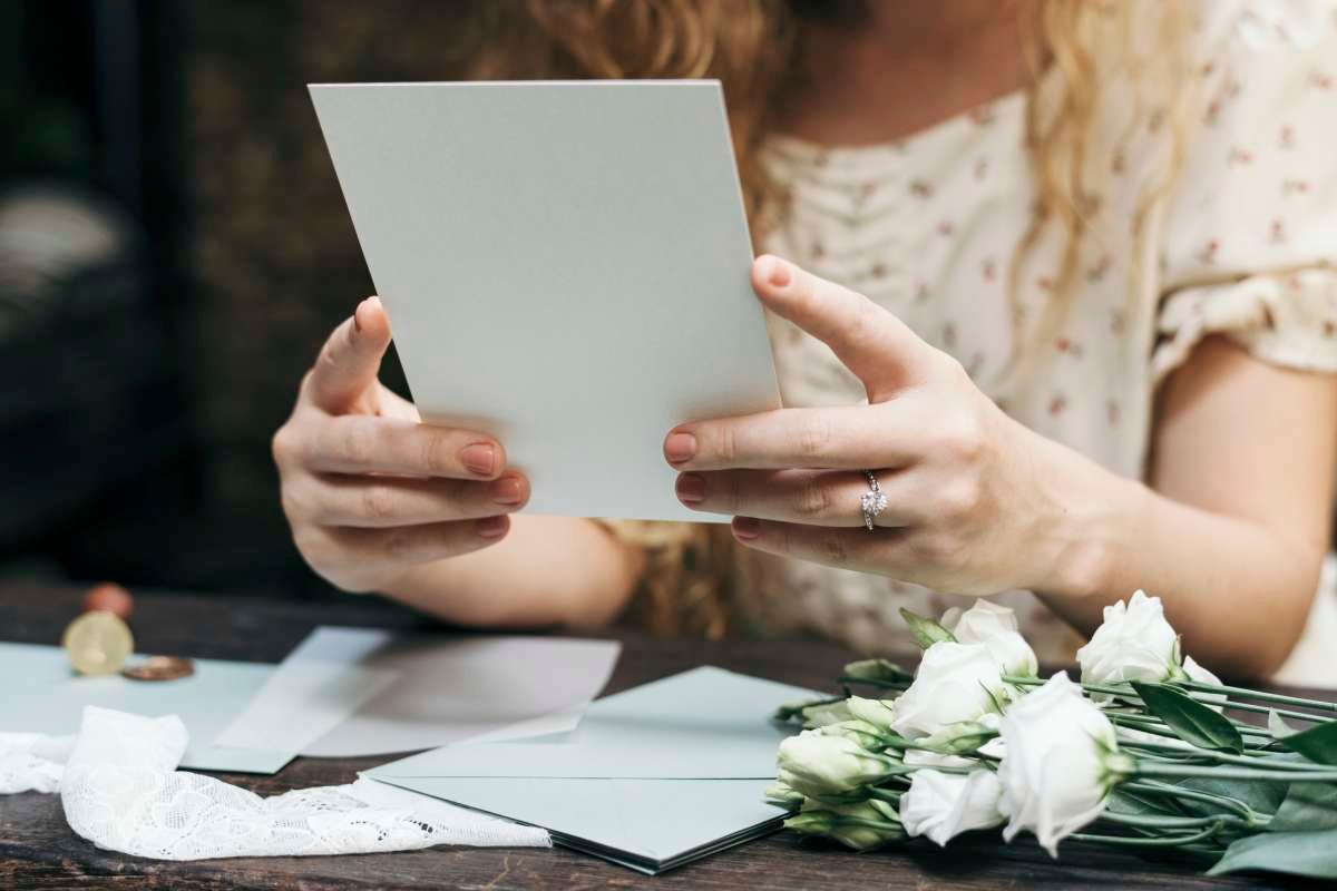 A young woman reflects on cherished memories while viewing a memorial display during funeral service