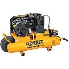 Yellow and black DeWalt air compressor with two wheels.