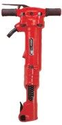 Red jackhammer tool with black handles, ready for demolition work.