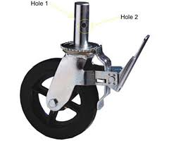 Black rubber wheel with silver metal caster and pin holes labeled 1 and 2.