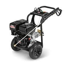 Black and silver pressure washer with a gas engine, on black wheels, with a black handle and controls.