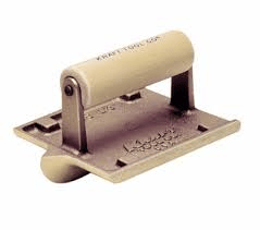 Concrete edger tool with a wooden handle.