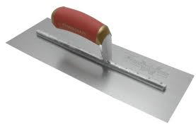 Trowel with a red handle, used for smoothing surfaces, lying on a white background.