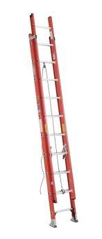 Red extension ladder leaning against a white background.