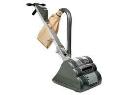 Floor sander, gray and silver, with a handle and dust collection bag, angled against a white background.
