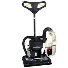 A floor sander with a dust collection bag, for wood floor refinishing.