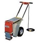 A walk-behind floor scraper, gray and red, with a handle, ready to remove floor covering.