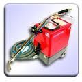 Red carpet cleaning machine on a light blue background, with a silver hose and handle.