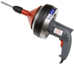 A hand-held electric drain snake with a red cone, black rubber housing, and gray handle.