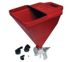 Red hopper gun for applying texture to walls, with nozzles and attachments.