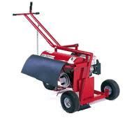 Red and black field striping machine with handle and wheels.