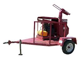 Red wood chipper on a trailer with a yellow tank, ready for operation.