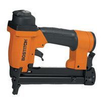 Orange and black Bostitch pneumatic stapler.