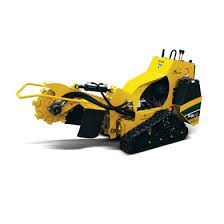 Yellow tracked stump grinder.