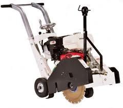 Concrete saw with a circular blade and a gasoline engine, outdoors.