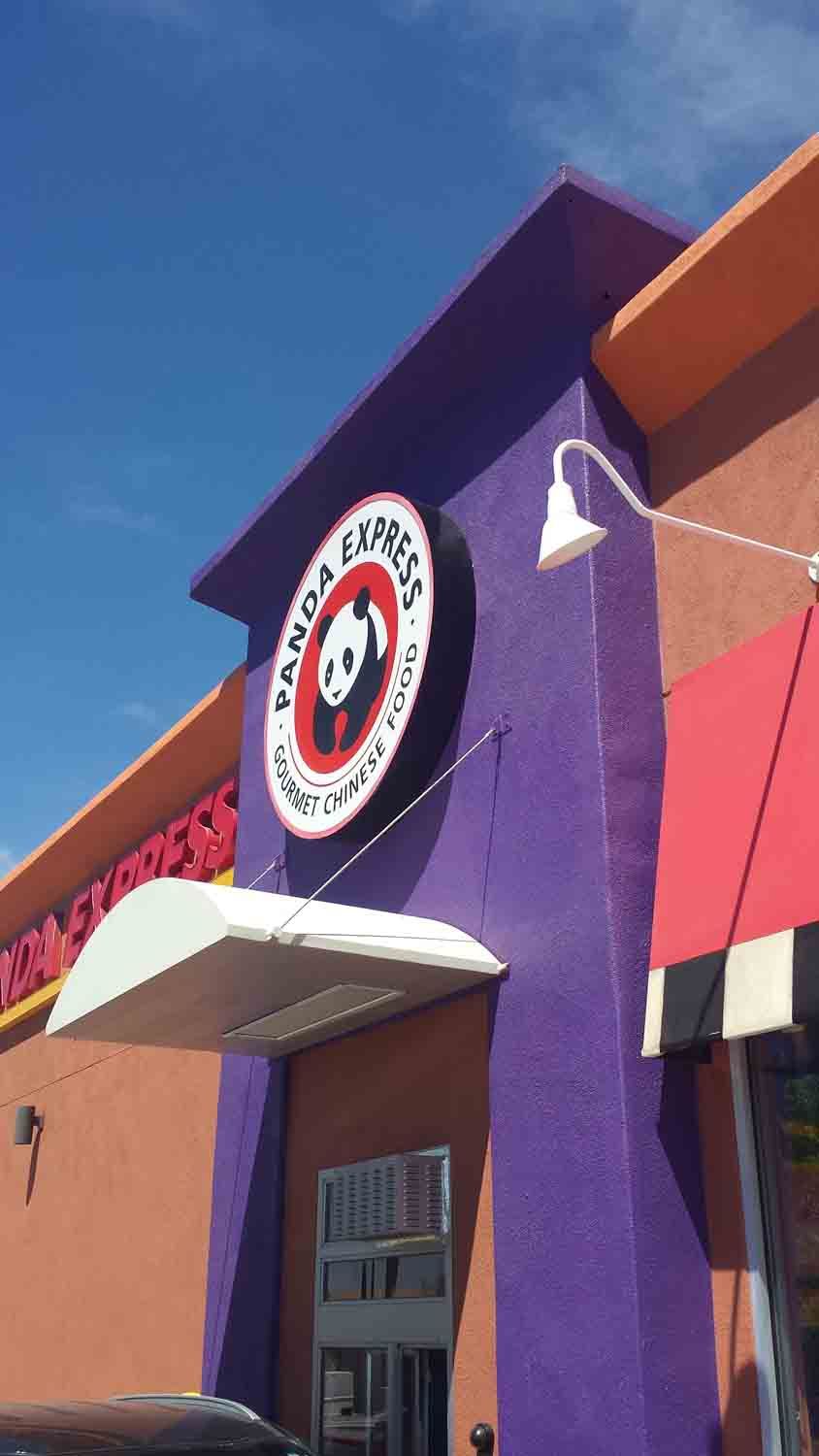 A purple building with a panda express sign on it