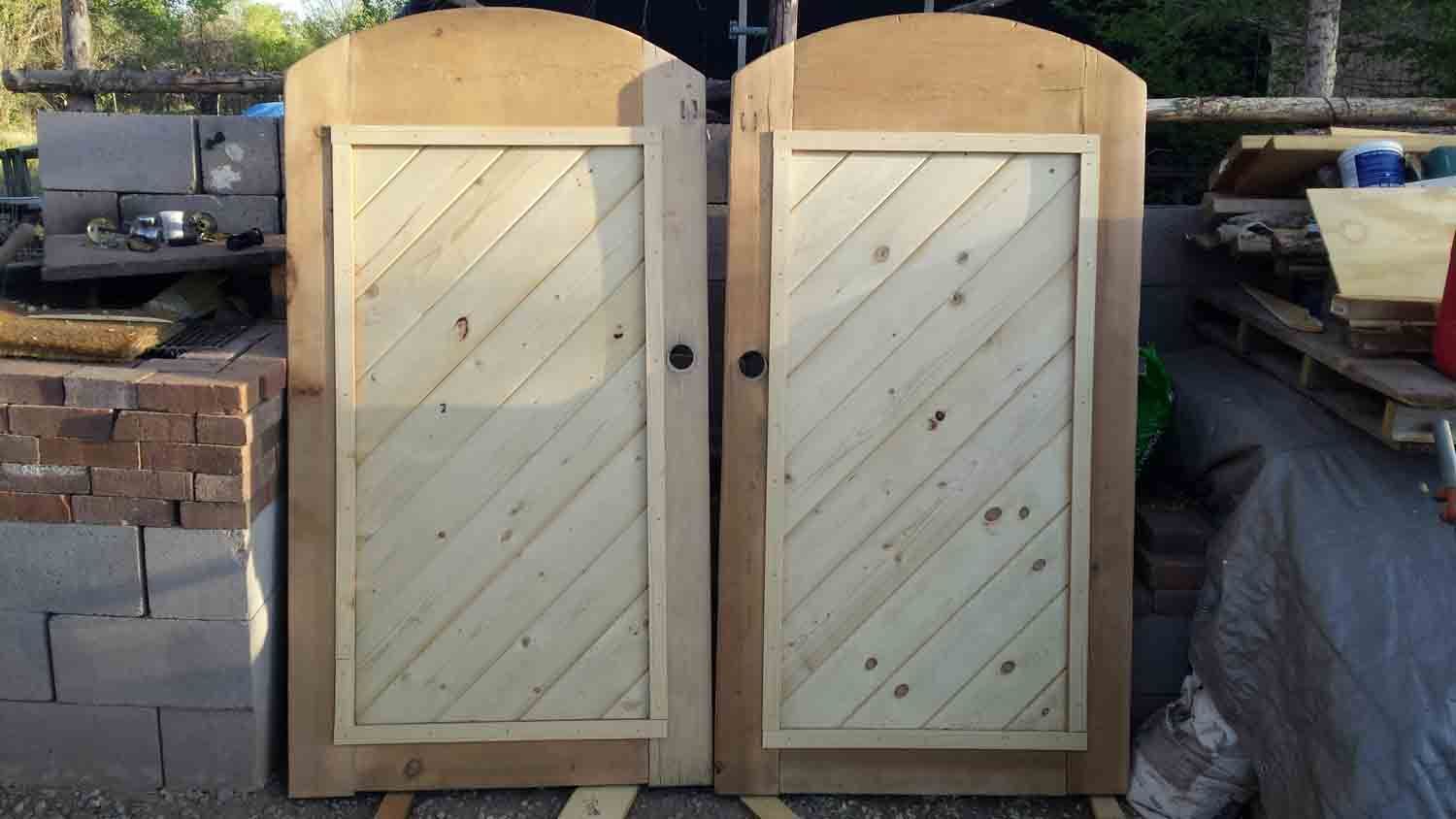 A pair of wooden doors sitting next to each other