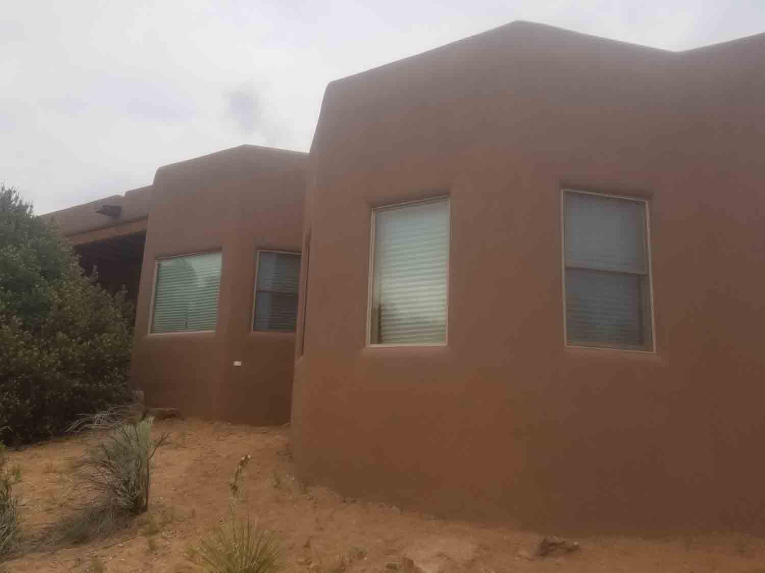 A house with a lot of windows on the side of it.