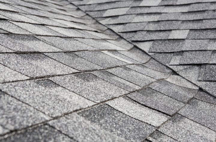 A close up of a roof with shingles on it.