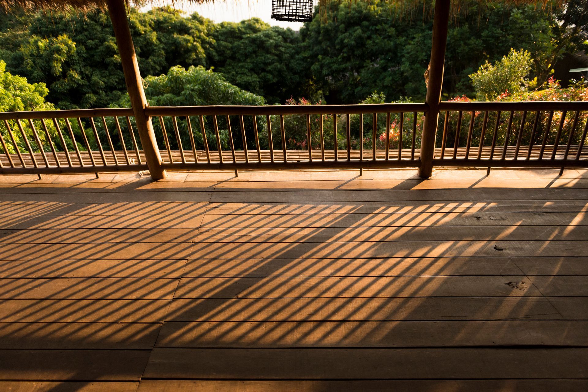 Wooden terrace overlooking lush green forest, serene nature view, perfect for relaxation, Custom Dec