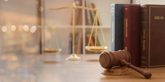 Balance Scales With Books And Judge Gavel — Ames, IA — Thornton & Coy, PLLC