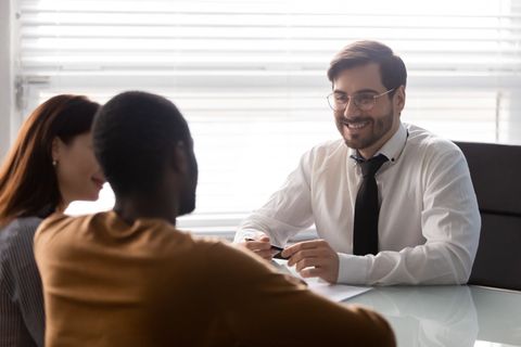 Attorney Talking To Young Couple — Ames, IA — Thornton & Coy, PLLC