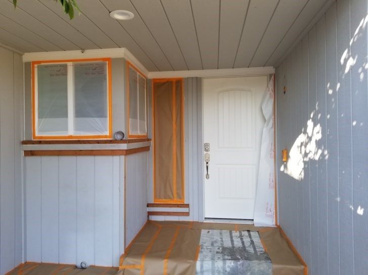 A room with a white door and a window