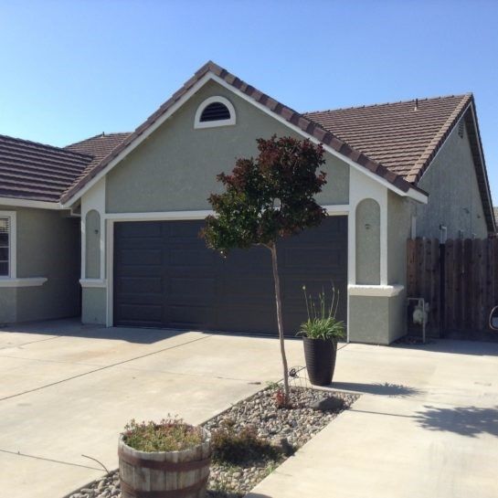 A house with a tree in front of it
