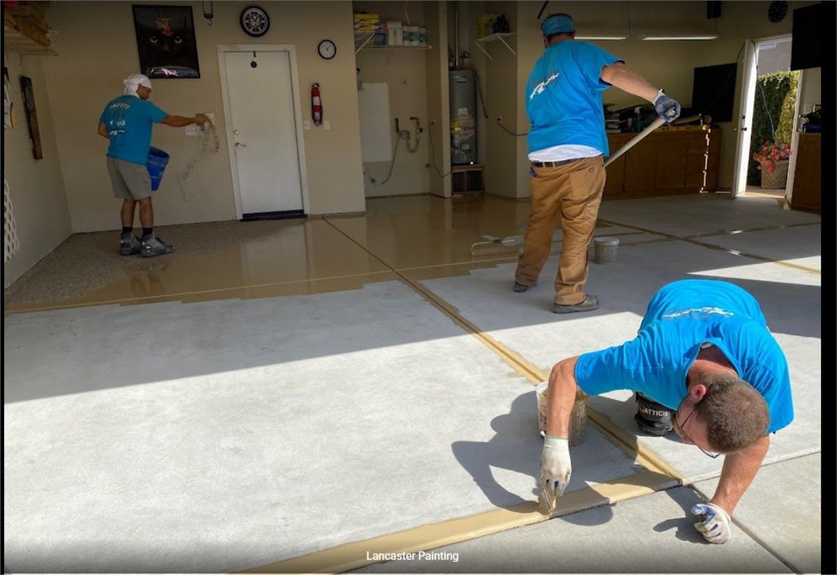 Lancaster Employees Coating Garage Floor