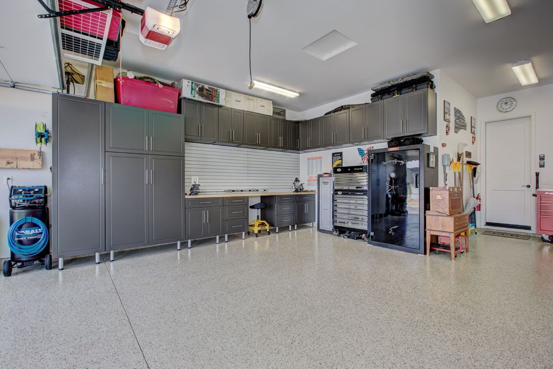 A large garage filled with lots of cabinets and tools.