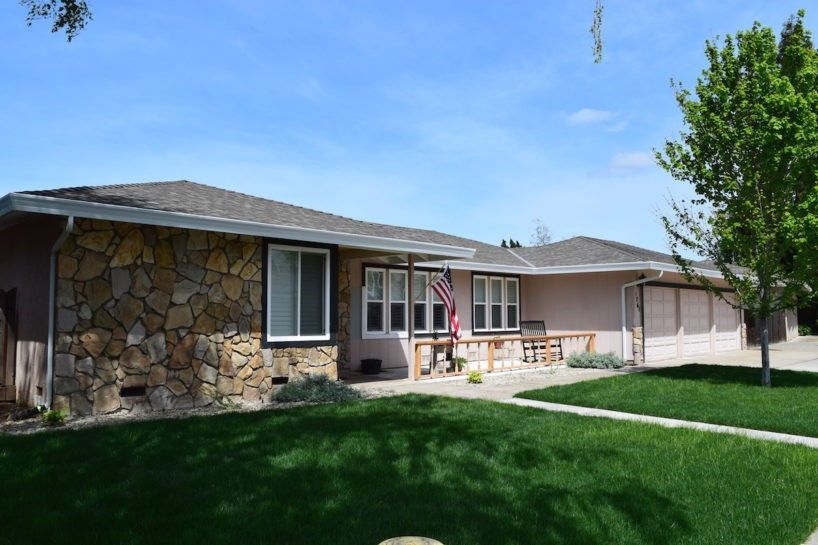 A house with a flag on the front porch