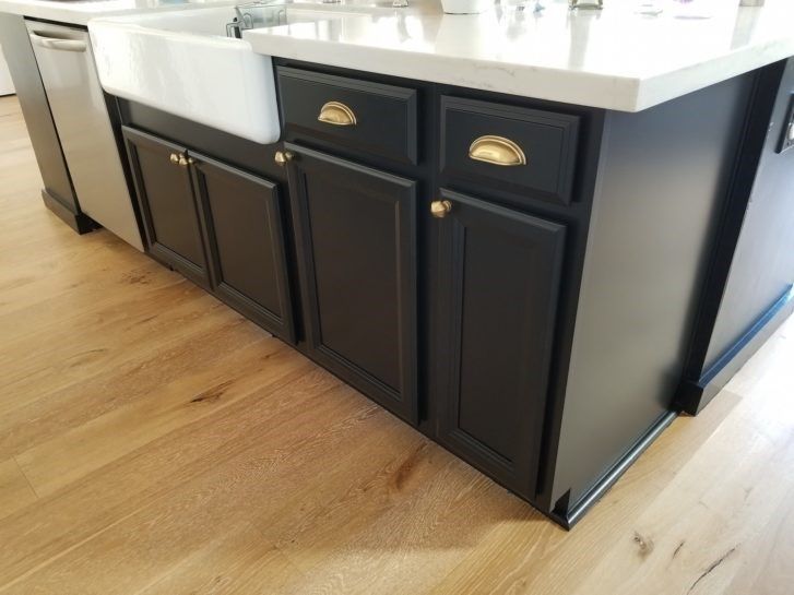 A photo of a recent cabinet painting job. Cabinets are a dark gray 