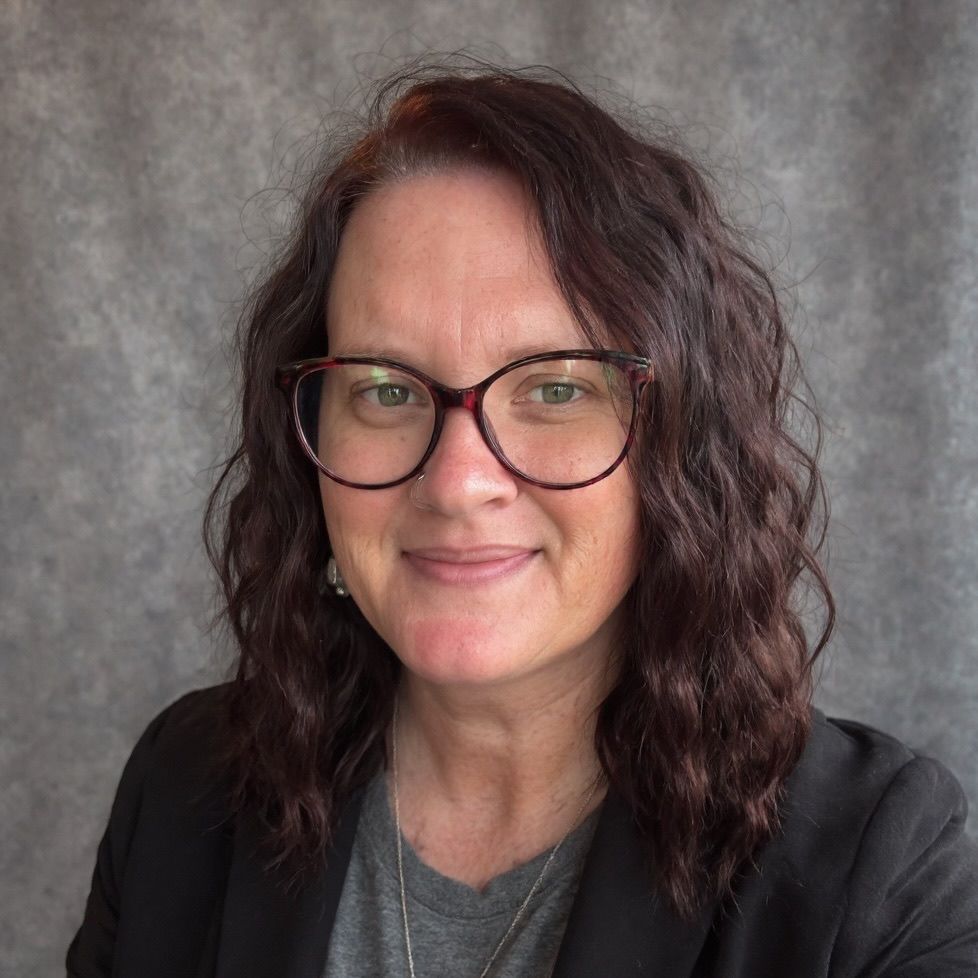 A gray icon of a person without a face on a white background.