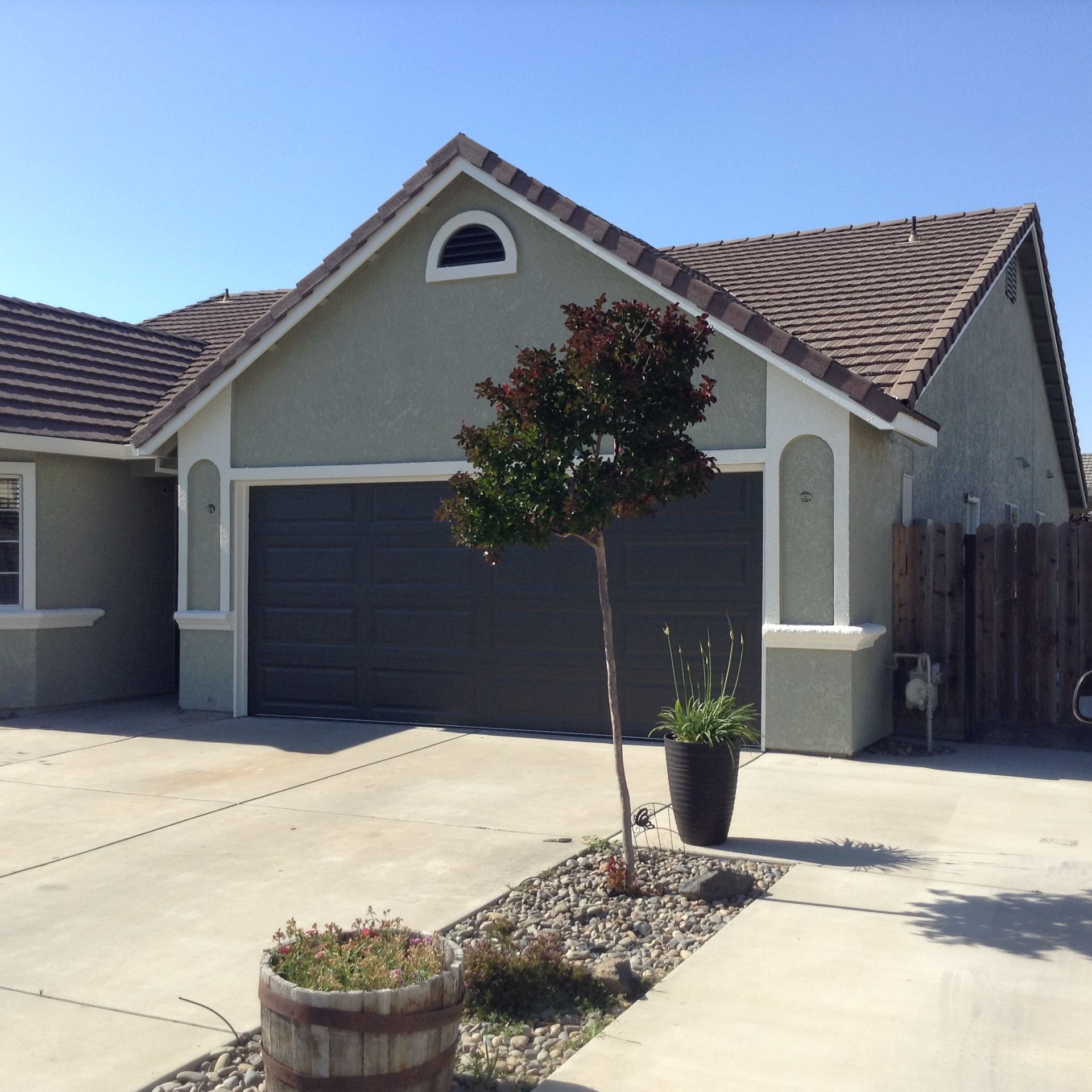 A house with a tree in front of it
