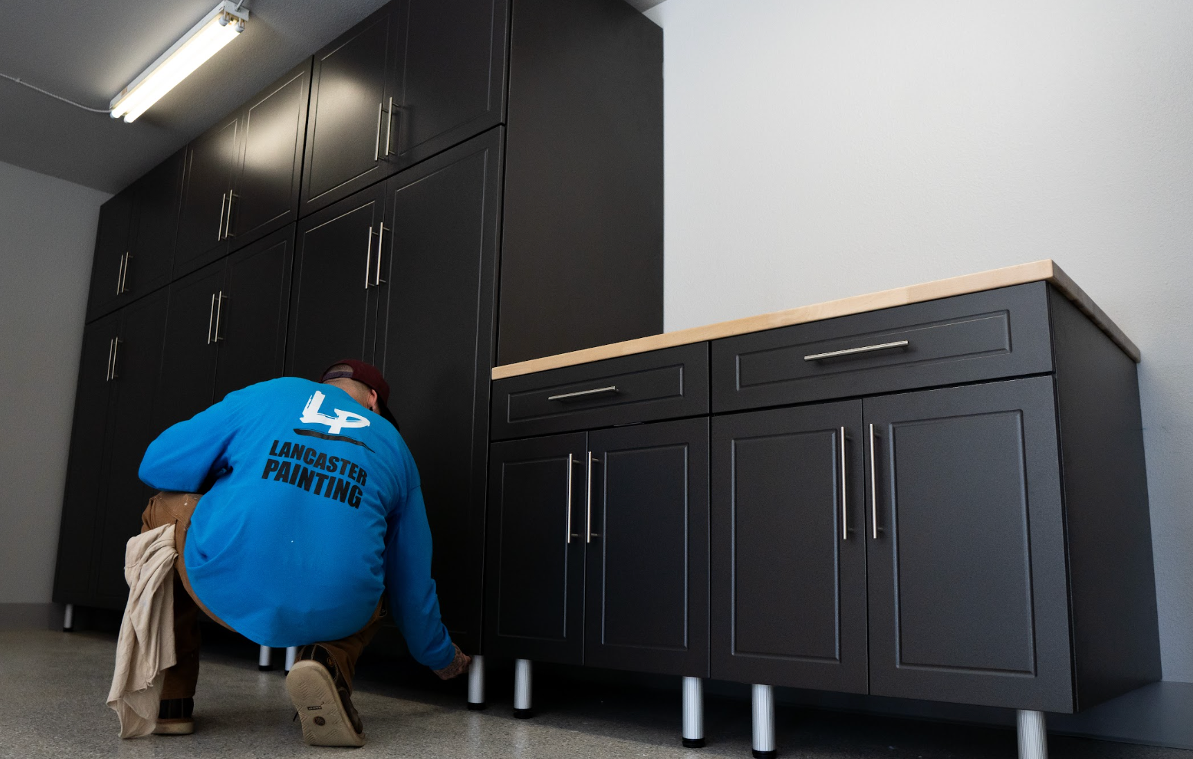 Lancaster Painting installing garage cabinets 