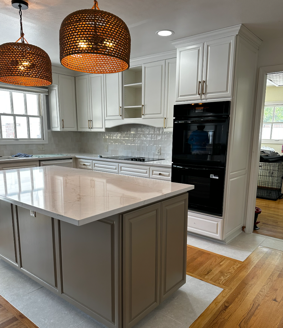 Kitchen cabinets after being painted white 