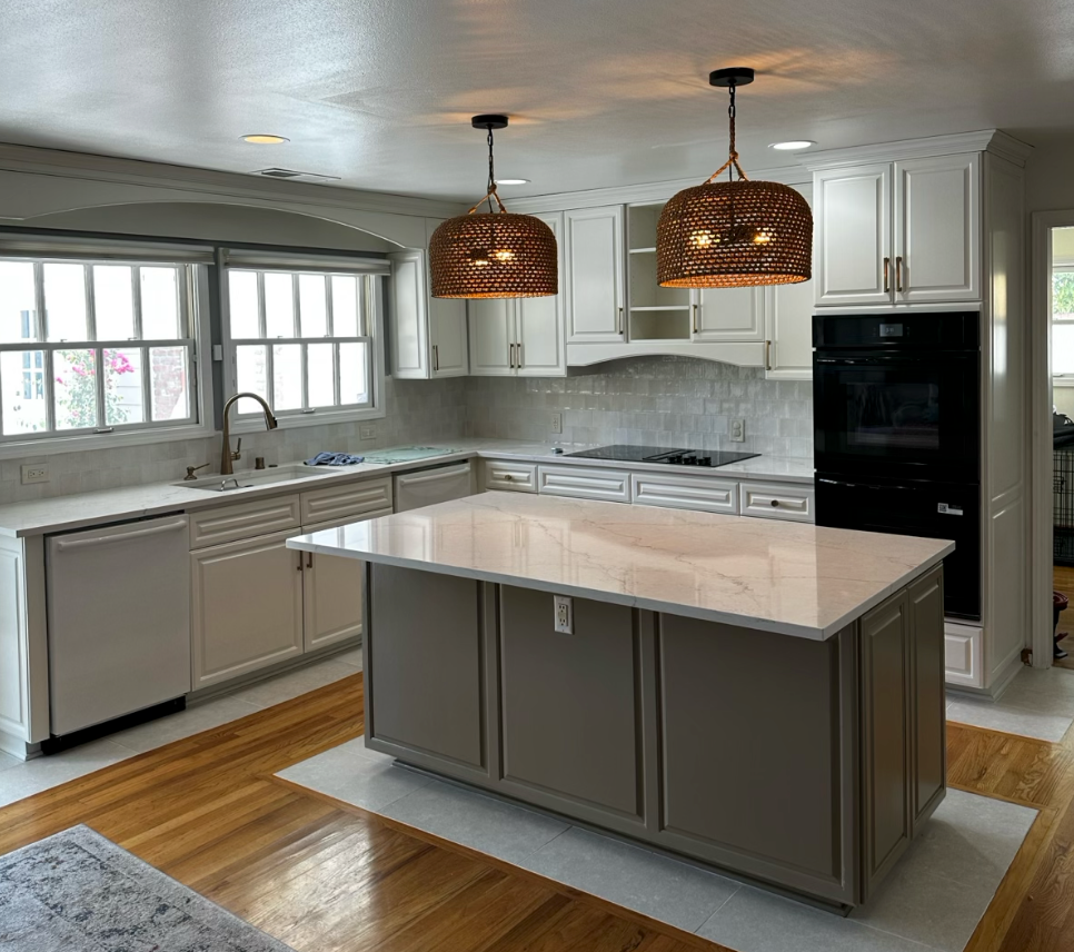 Kitchen cabinets after being painted white 