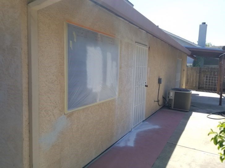 stucco repair in process
