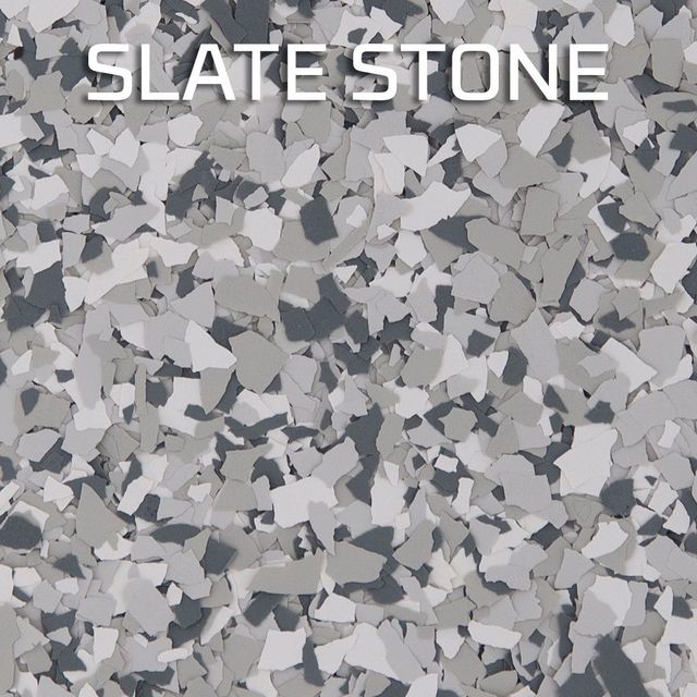 A close up of a gray , white and black slate stone floor.
