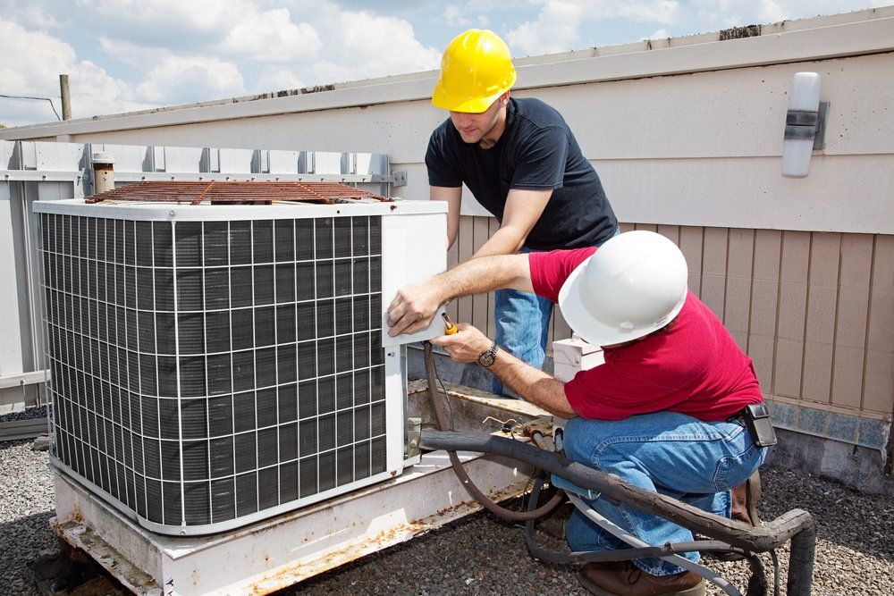 Technician Repairing AC