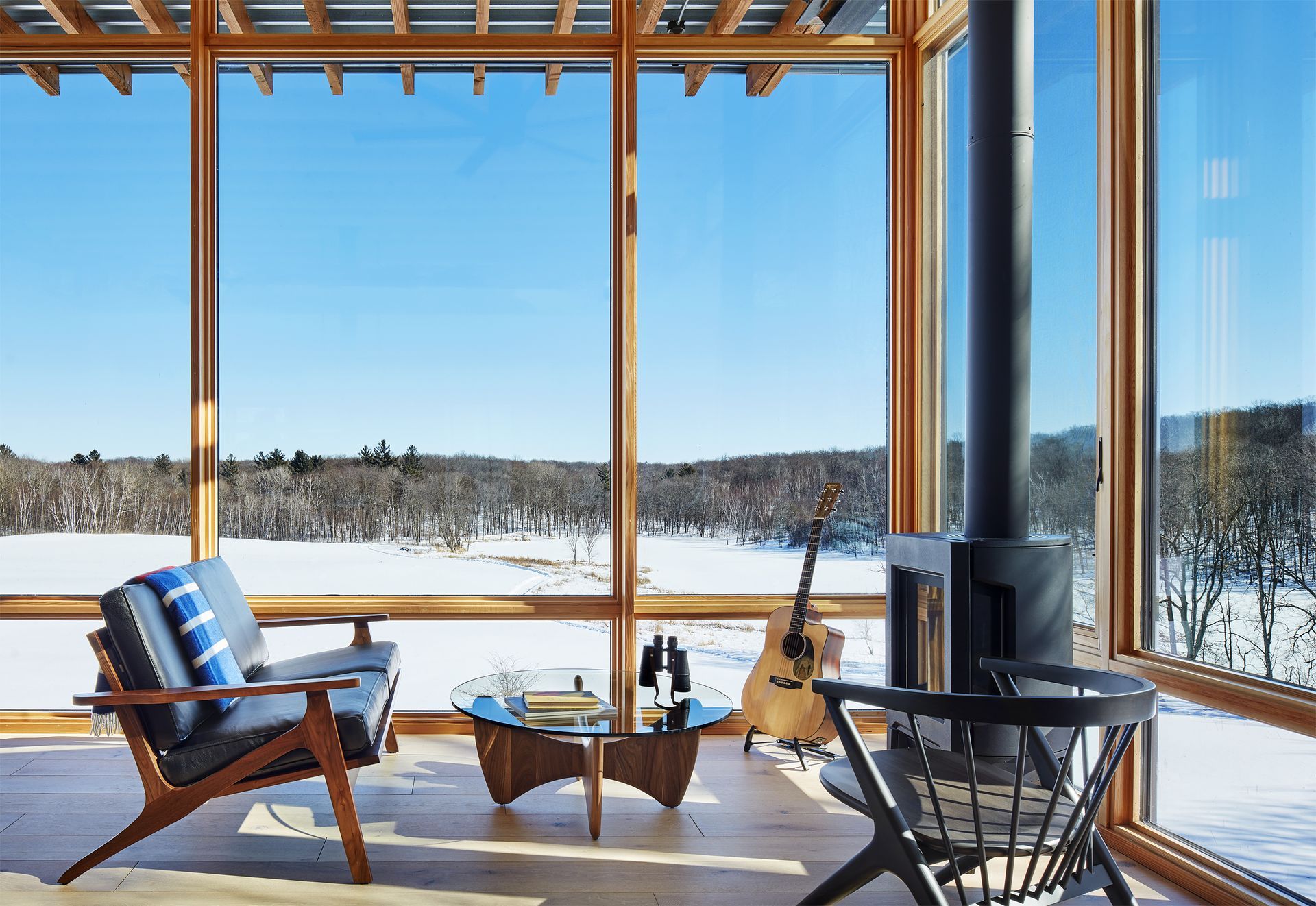 A large house with a swimming pool in front of it