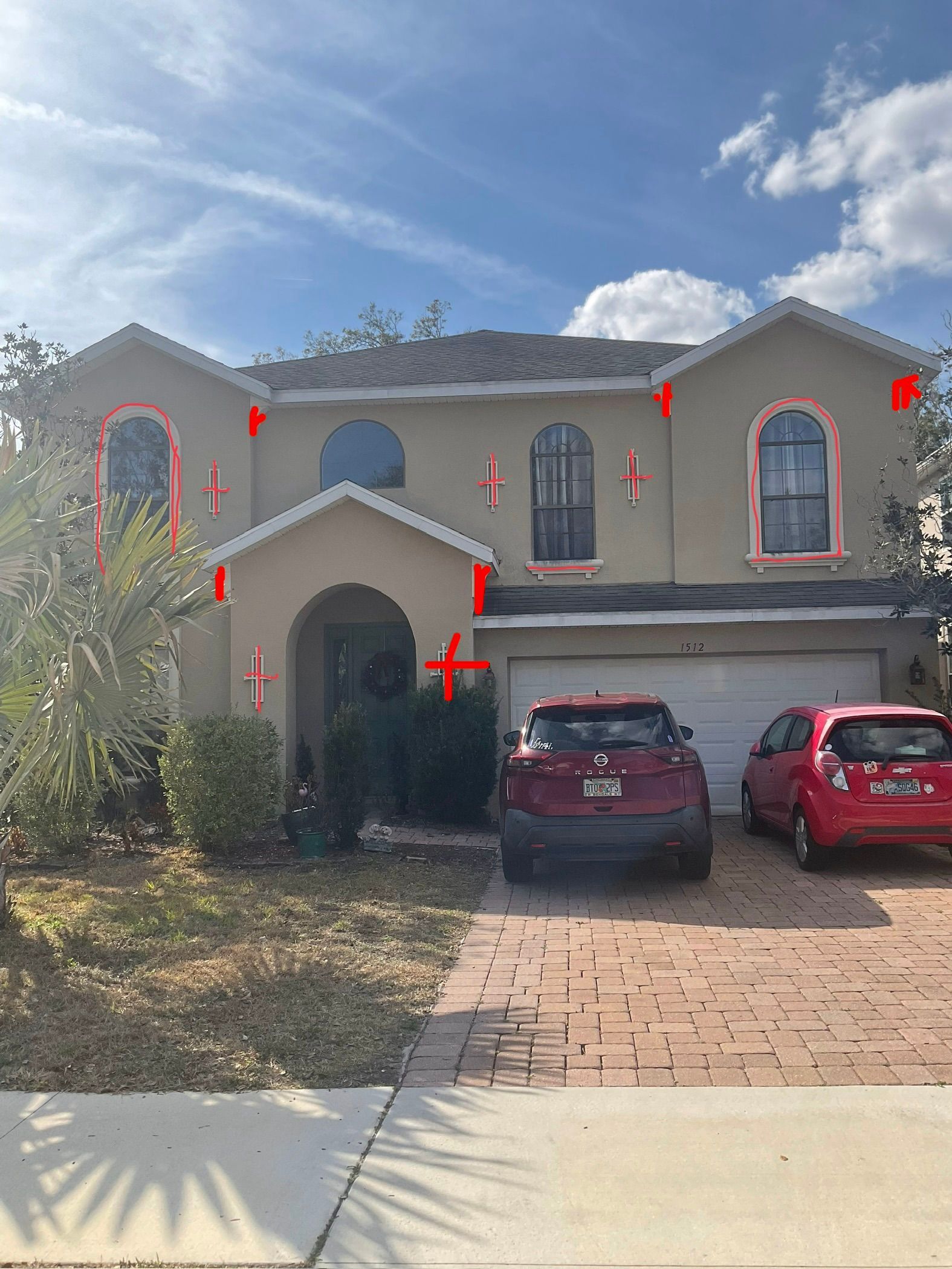 a 2 story stucco residential home in Deland, FL that atlantic finish llc properly sealed and prepared for paint
