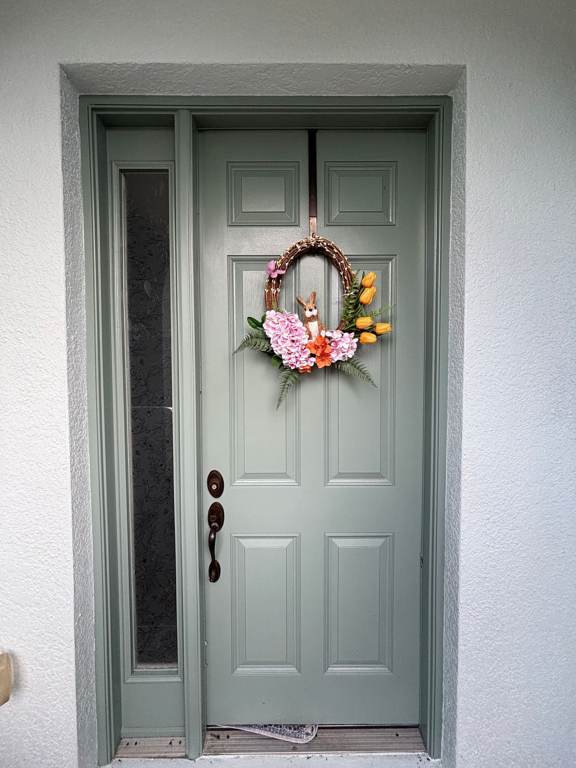 Professionally refinished and painted front door enhancing a home's curb appeal