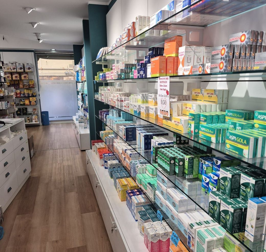 A pharmacy aisle filled with lots of products including popola