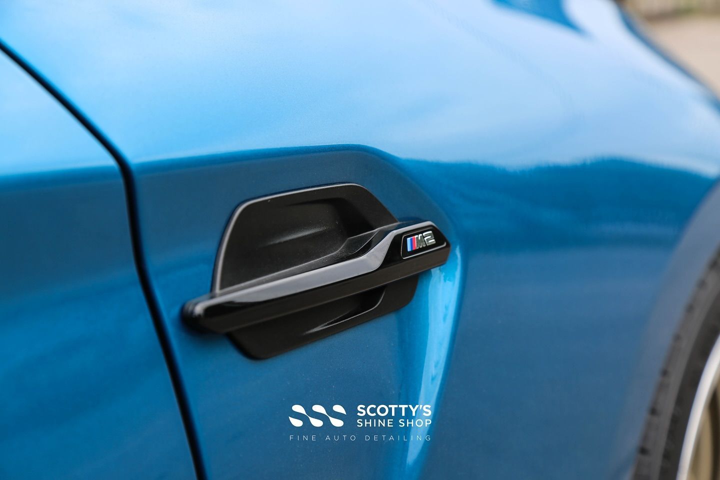 2018 BMW M2 Premium LLumar Formula 1 Pinnacle Ceramic Tint door handle emblem close up London, Ontario