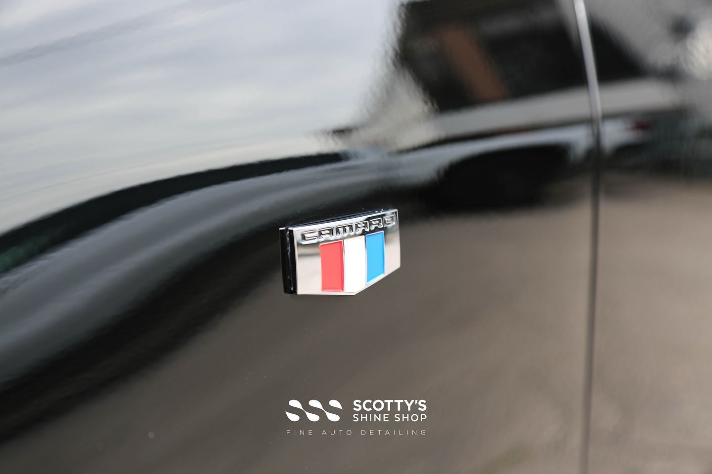 2018 Chevrolet Camaro badge after paint correction and dent removal at Scotty’s Shine Shop