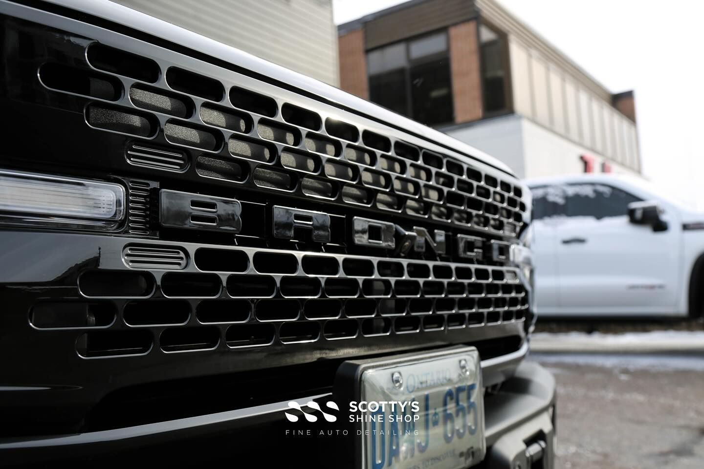 2024 Ford Bronco Wildtrak Polishing, Xpel Fusion Premium Ceramic Coating front end grill close up London, Ontario