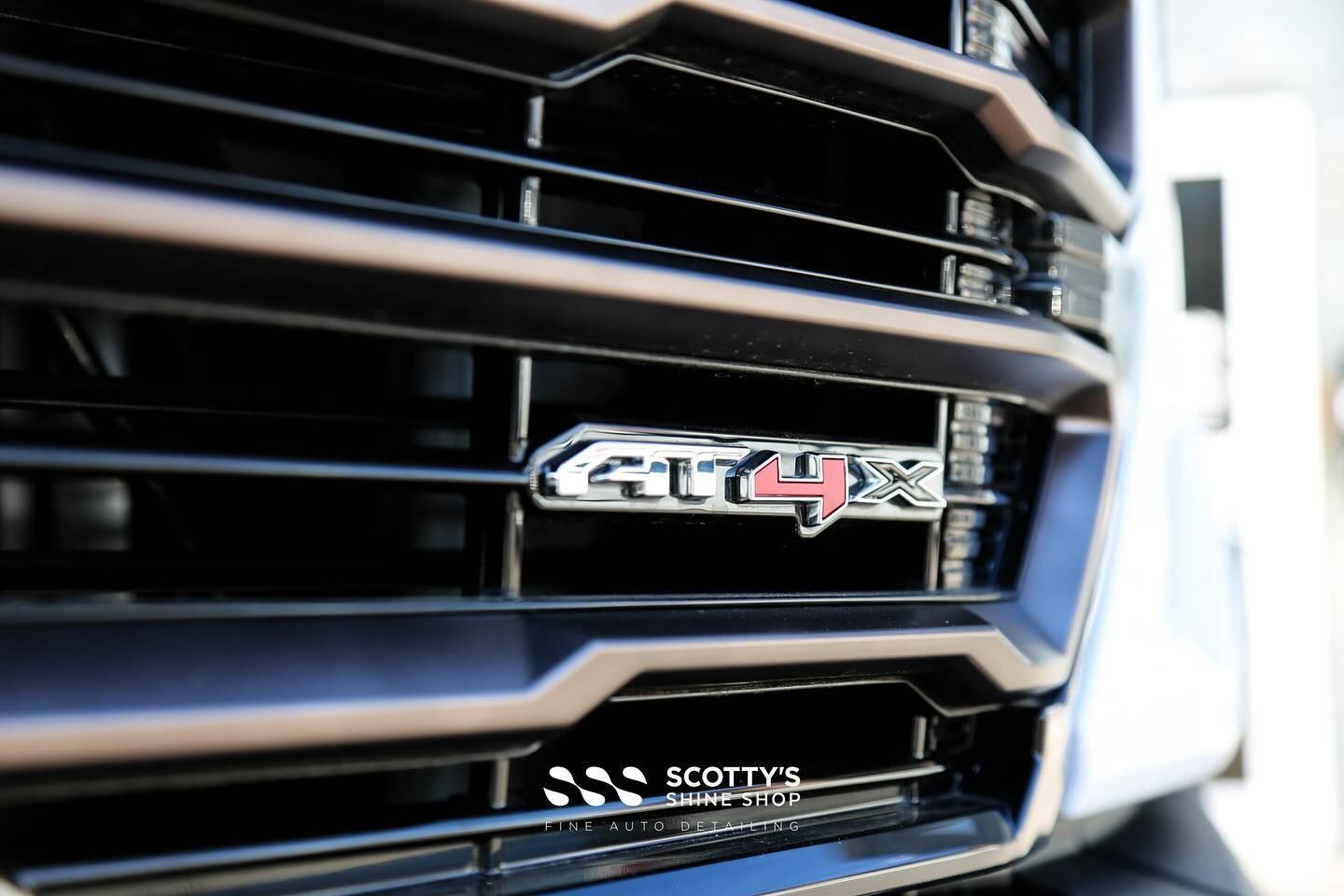 2024 GMC Sierra AT4X AEV Xpel Paint Protection Film, Ceramic Window Tint and Ceramic Coatings applied to Paint, Glass and Wheels front grill close up London, Canada